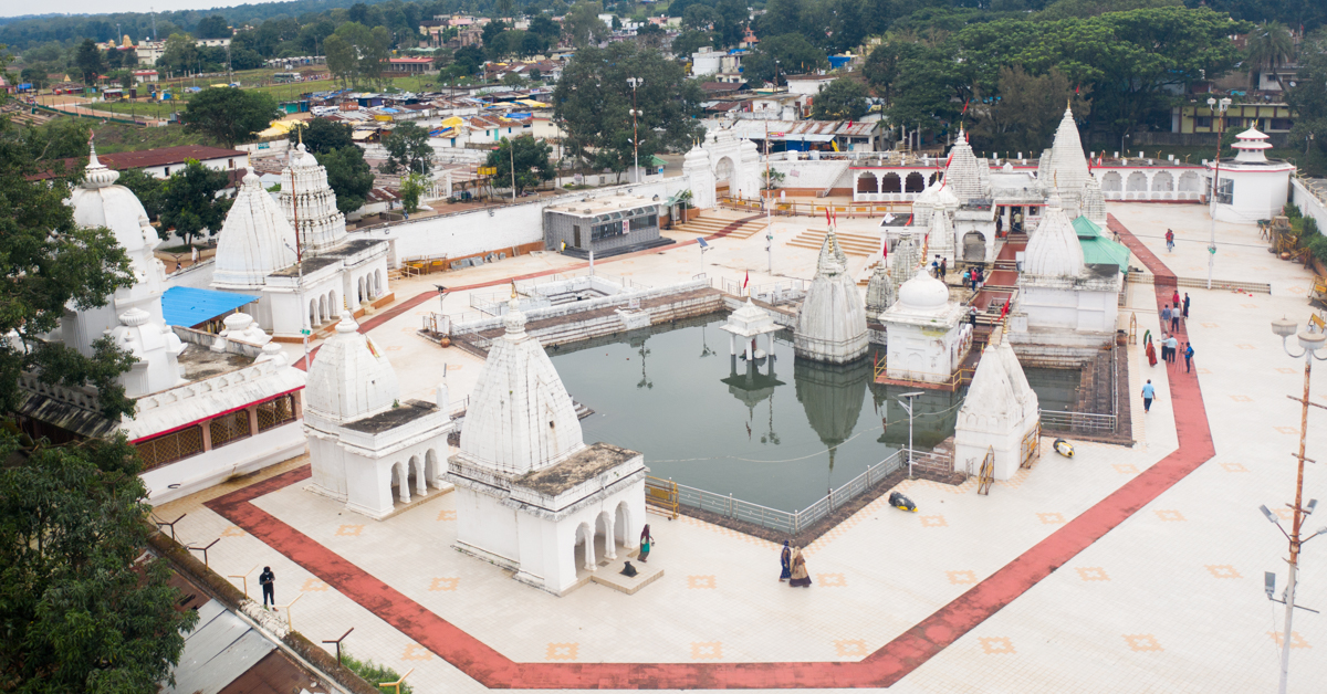  Narmada Udgam Sthan beautifully sculpture with small shrines different gods and goddesses in white color.